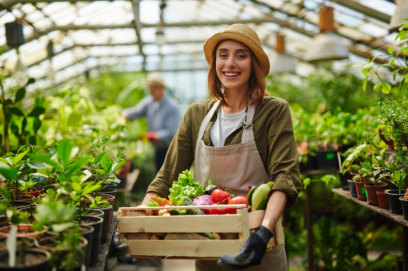 Woman working in green house